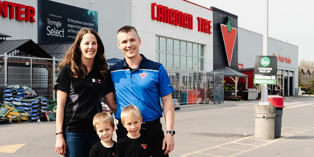 Greg and his family outside their Canadian Tire store