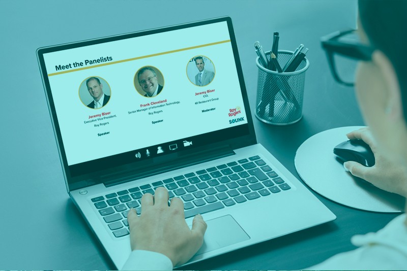 An image of a person using a laptop with a screen that reads a webinar.