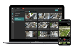 A laptop, tablet, and phone with a view of a home security camera.