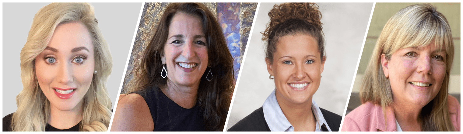 Four women are smiling in front of a camera.